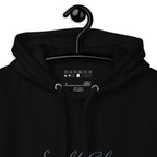 Black unisex cotton hoodie featuring Potrero Hill Coyote design from ST. Francis and Friends, with a hood and front pocket.