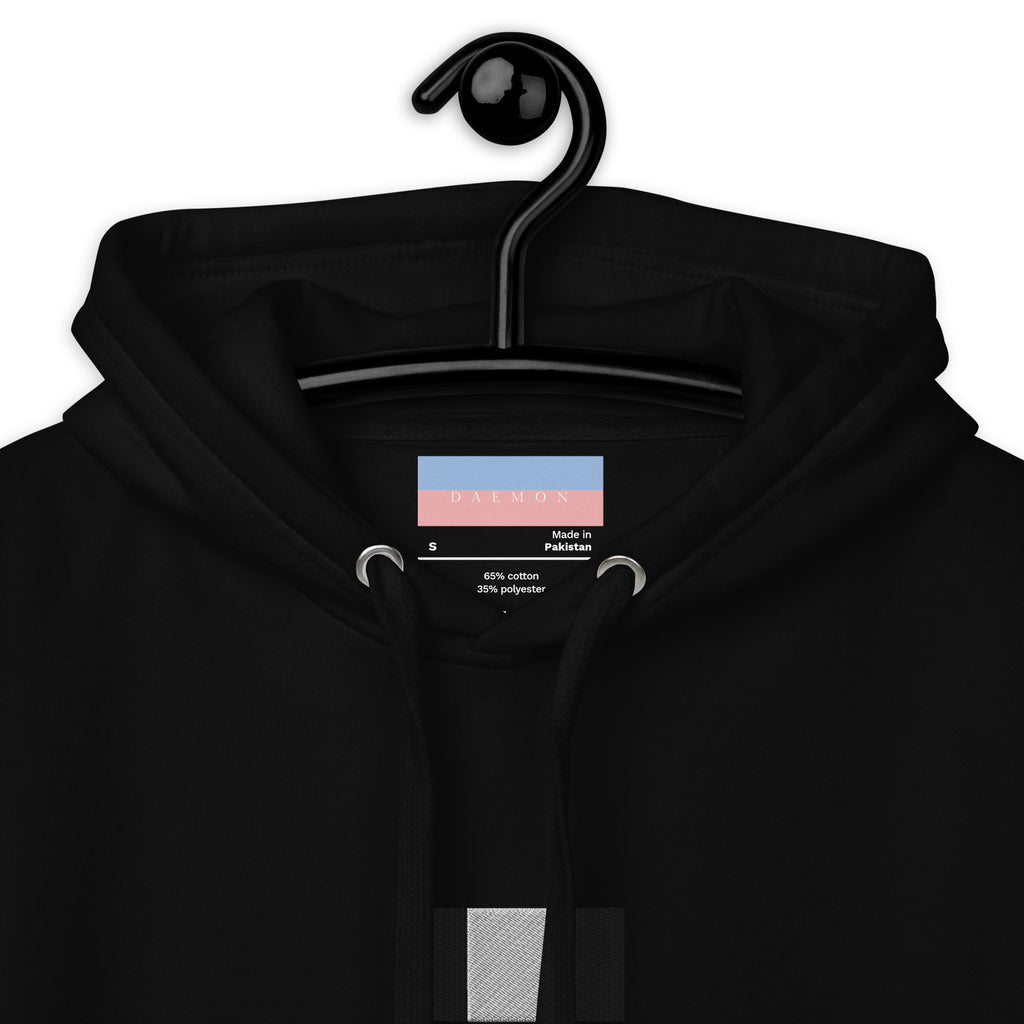 Daemon Stealth Pardon unisex black hoodie with cotton heritage fabric and drawstring hood, close-up view showing fabric texture.