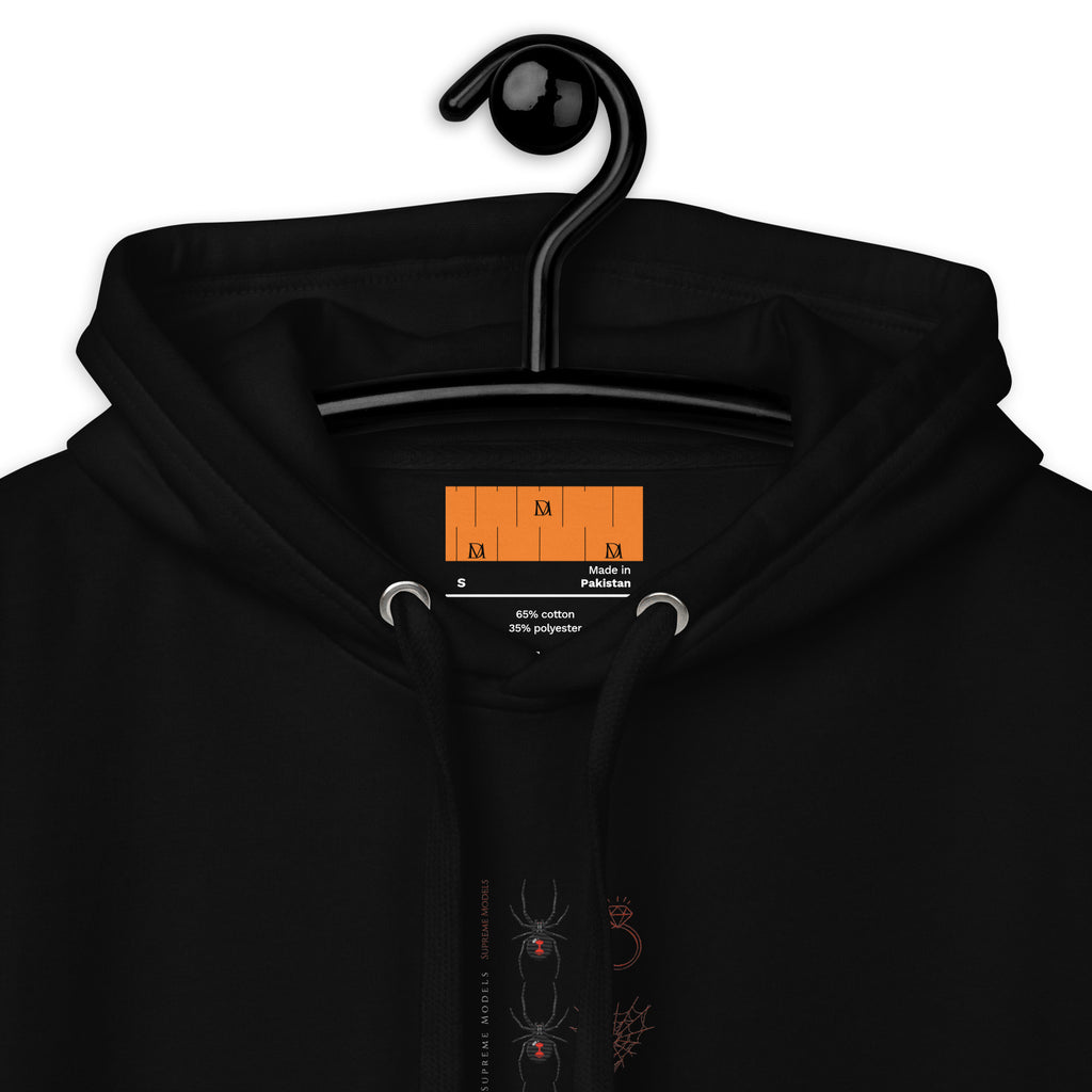Daemon Luxury Supreme Models (Widowed) black hoodie, unisex cotton hoodie with hood and front pocket, close-up view.