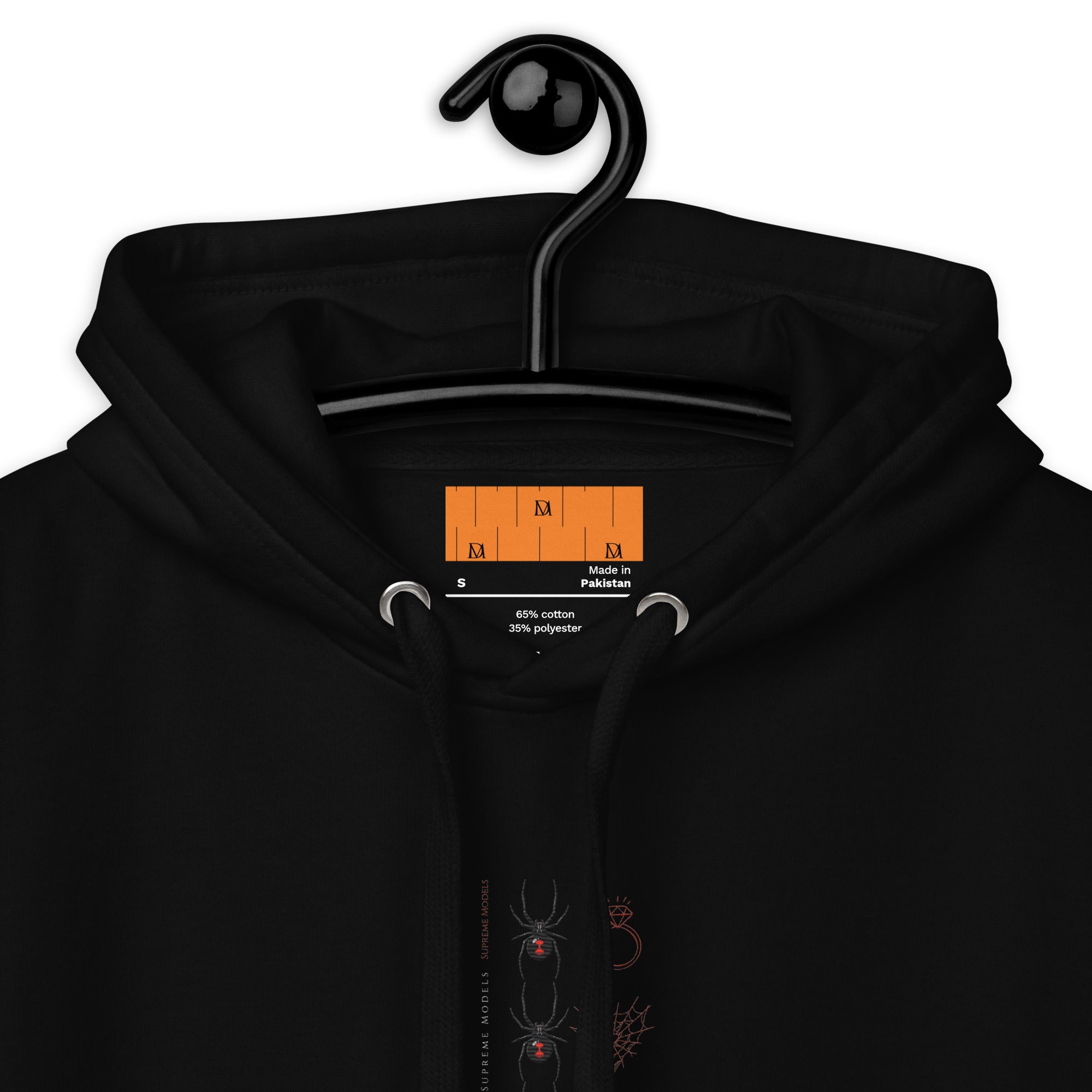 Daemon Luxury Supreme Models (Widowed) black hoodie, unisex cotton hoodie with hood and front pocket, close-up view.