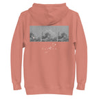 Unisex Dusty Rose cotton hoodie with apricot bandit design by Daemon, featuring a hood and relaxed fit.