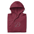 Maroon unisex luxury hoodie from Daemon's Distilled Love collection, featuring a cotton heritage fabric and a front design.
