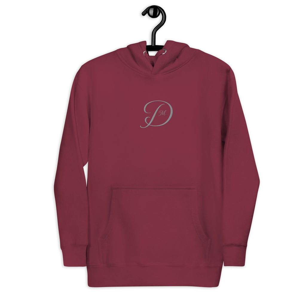 Maroon unisex luxury hoodie by Daemon featuring a front logo and premium cotton heritage fabric.