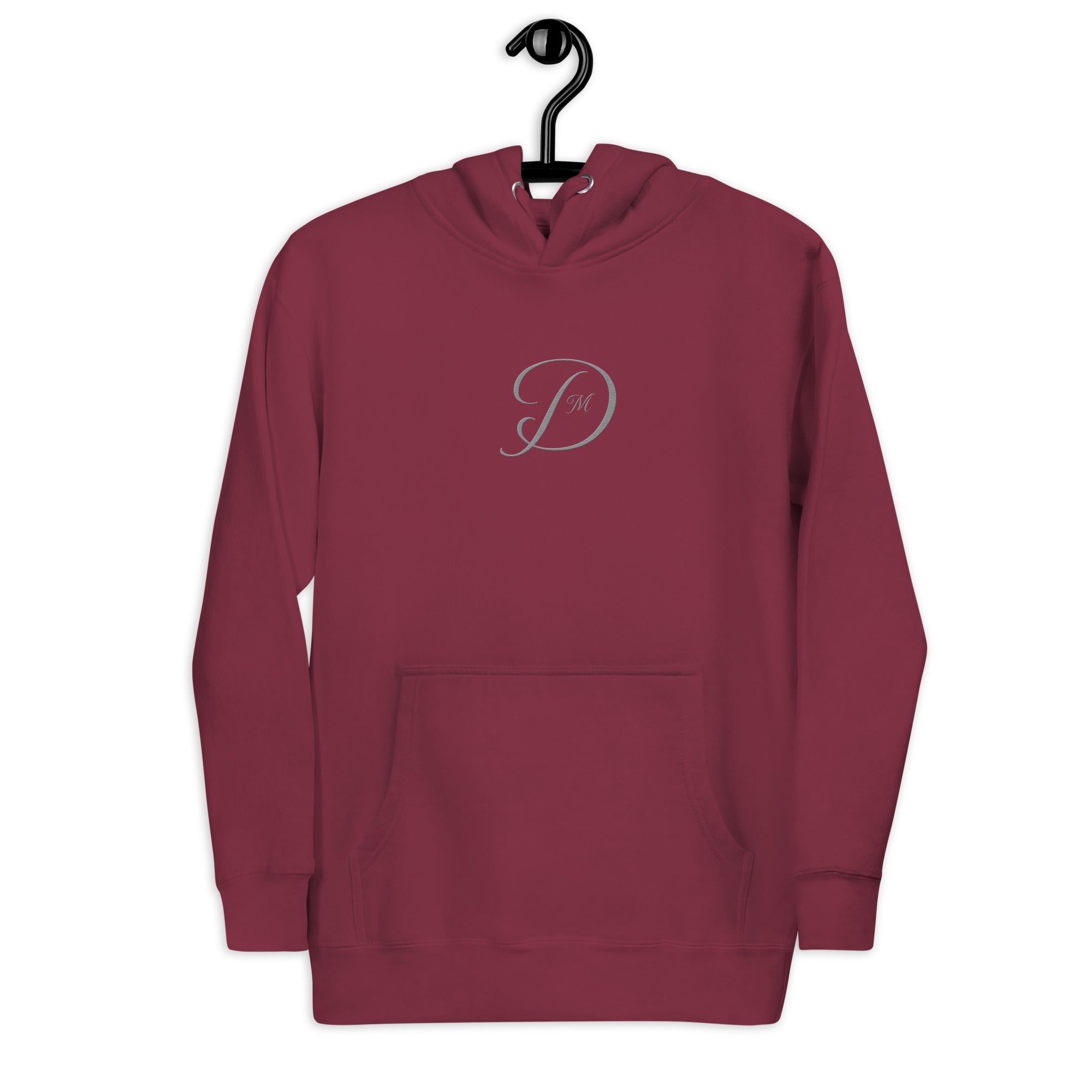 Maroon unisex luxury hoodie by Daemon featuring a front logo and premium cotton heritage fabric.