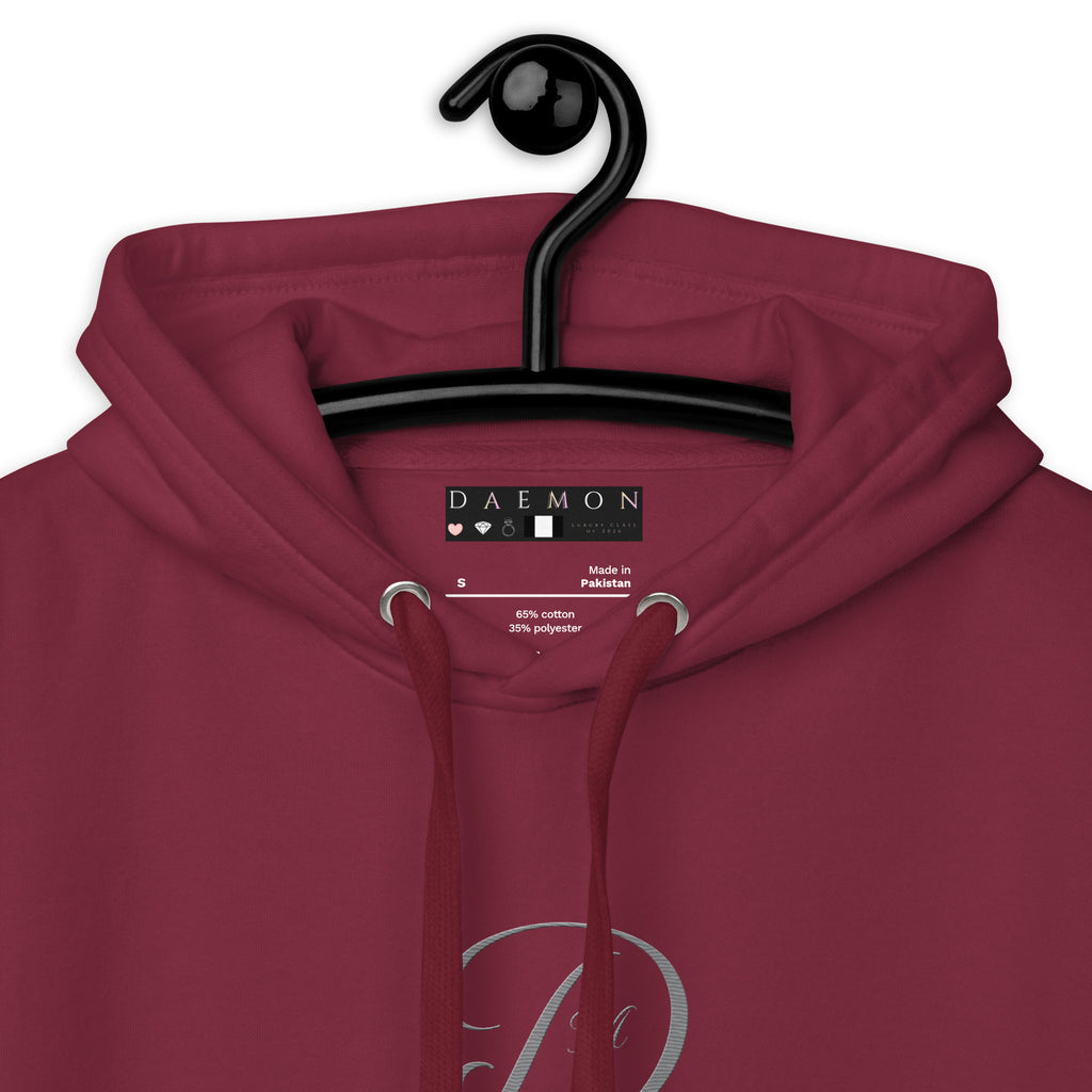 Maroon unisex hoodie by Daemon with a cotton heritage fabric, featuring a premium design and a cozy hood.