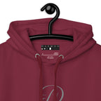 Maroon unisex hoodie by Daemon with a cotton heritage fabric, featuring a premium design and a cozy hood.