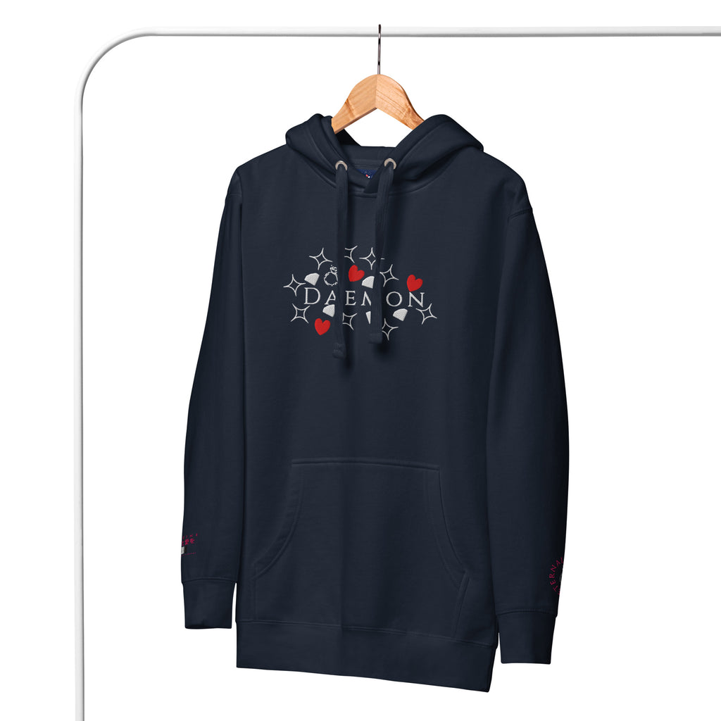 Unisex navy blue cotton hoodie from Daemon with "Rings of Transition" design and a front pocket.