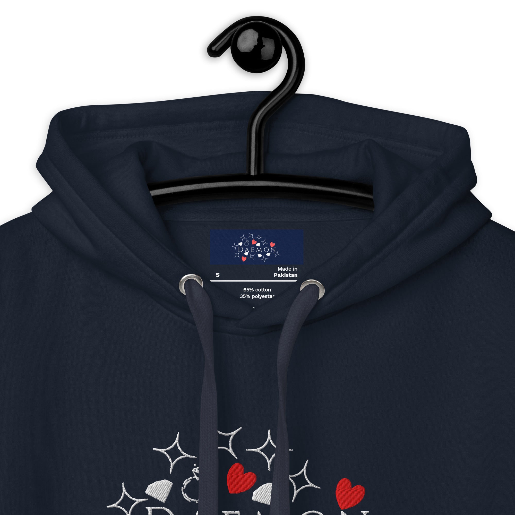 Close-up of Daemon Rings of Transition cotton hoodie with navy blazer color, featuring a hood and textured fabric.