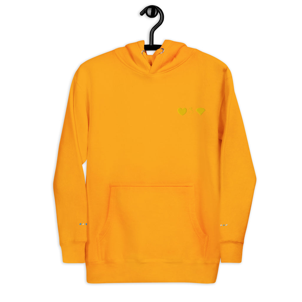 Unisex gold hoodie from Daemon with a cotton heritage fabric and front logo design, featuring a cozy pullover style with a hood.