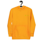 Unisex gold hoodie from Daemon with a cotton heritage fabric and front logo design, featuring a cozy pullover style with a hood.