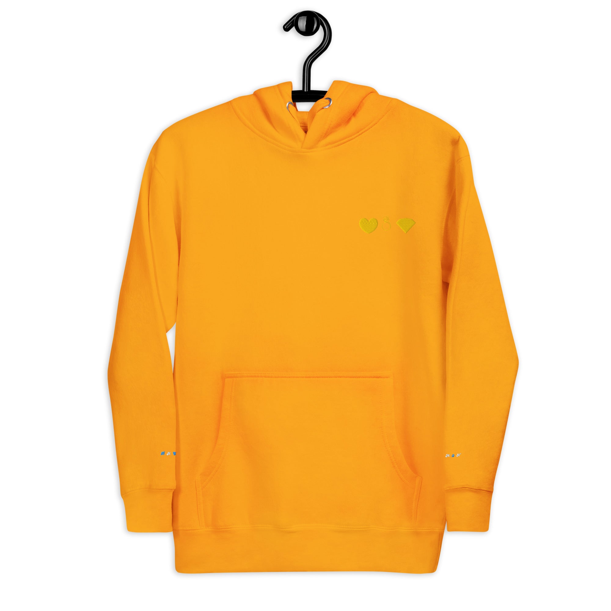 Unisex gold hoodie from Daemon with a cotton heritage fabric and front logo design, featuring a cozy pullover style with a hood.