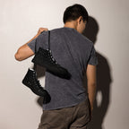Black men's high-top canvas shoes by Daemon Luxury featuring frosted diamond accents and platinum detailing.