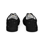 Black men's lace-up canvas shoes with frosted diamond accents and platinum detailing from Daemon Luxury.