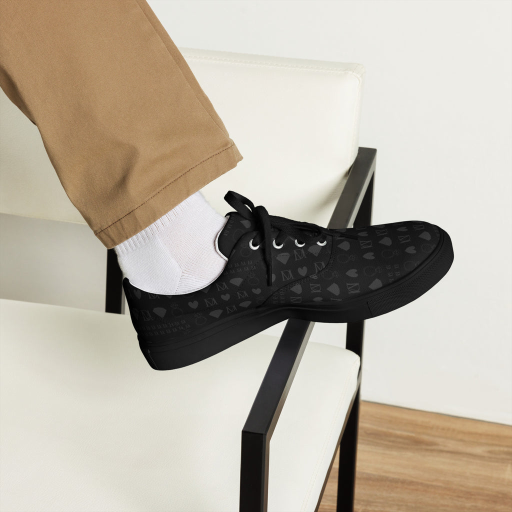 Black men's lace-up canvas shoes with frosted diamond detailing and platinum accents by Daemon Luxury, front view.