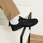 Black men's lace-up canvas shoes with frosted diamond detailing and platinum accents by Daemon Luxury, front view.
