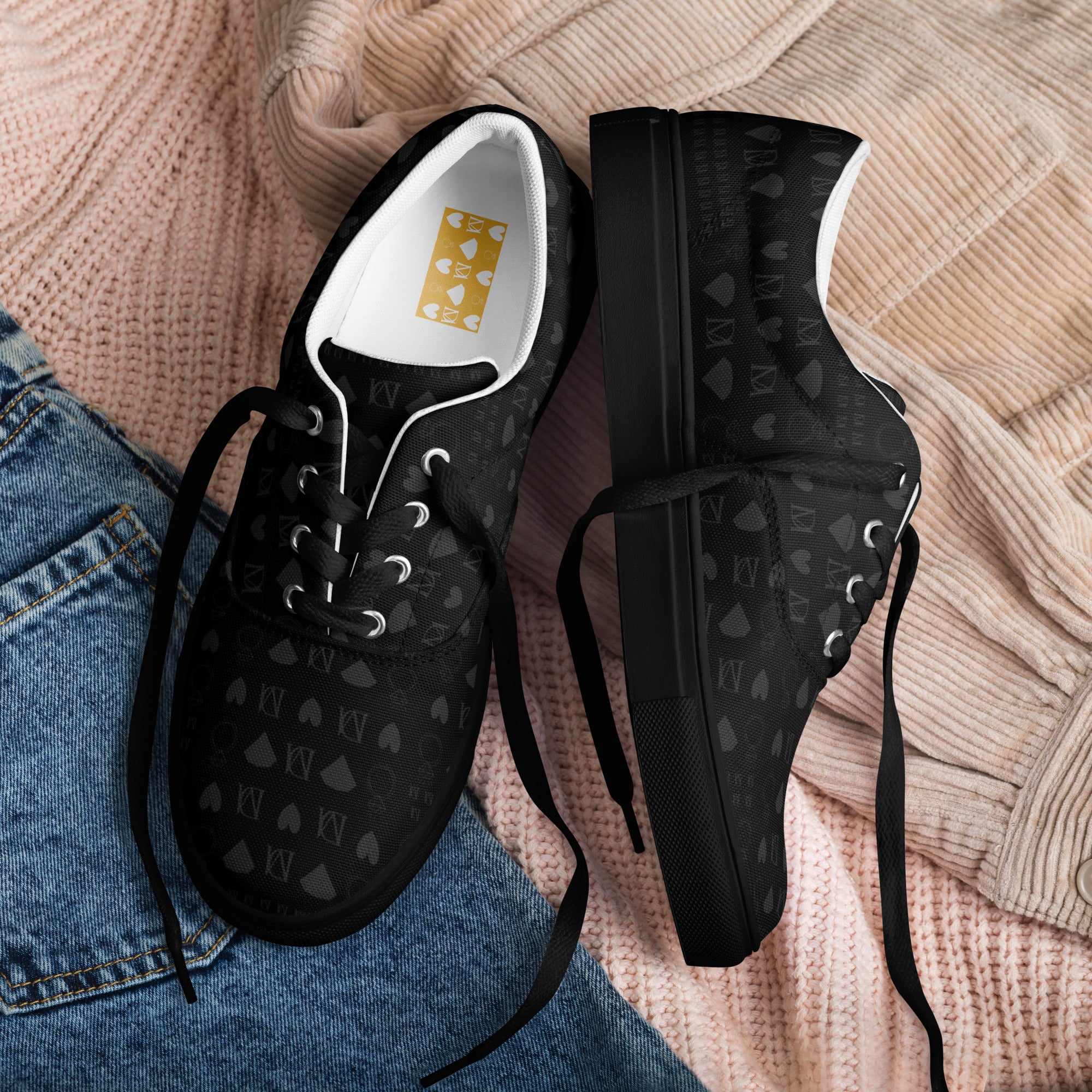 Black men's lace-up canvas shoes featuring frosted diamond details by Daemon Luxury, front view with stylish design.