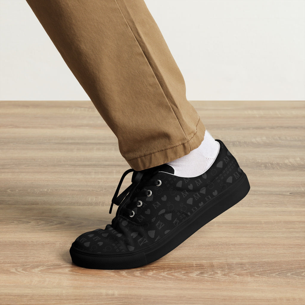 Black men's lace-up canvas shoes from Daemon Luxury with frosted diamond accents on a sleek front view.