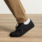Black men's lace-up canvas shoes with speckled diamond pattern by Daemon Luxury, front view showcasing stylish design.