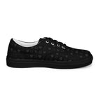 Black men's lace-up canvas shoes by Daemon Luxury with frosted diamond accents, shown from inside left angle.