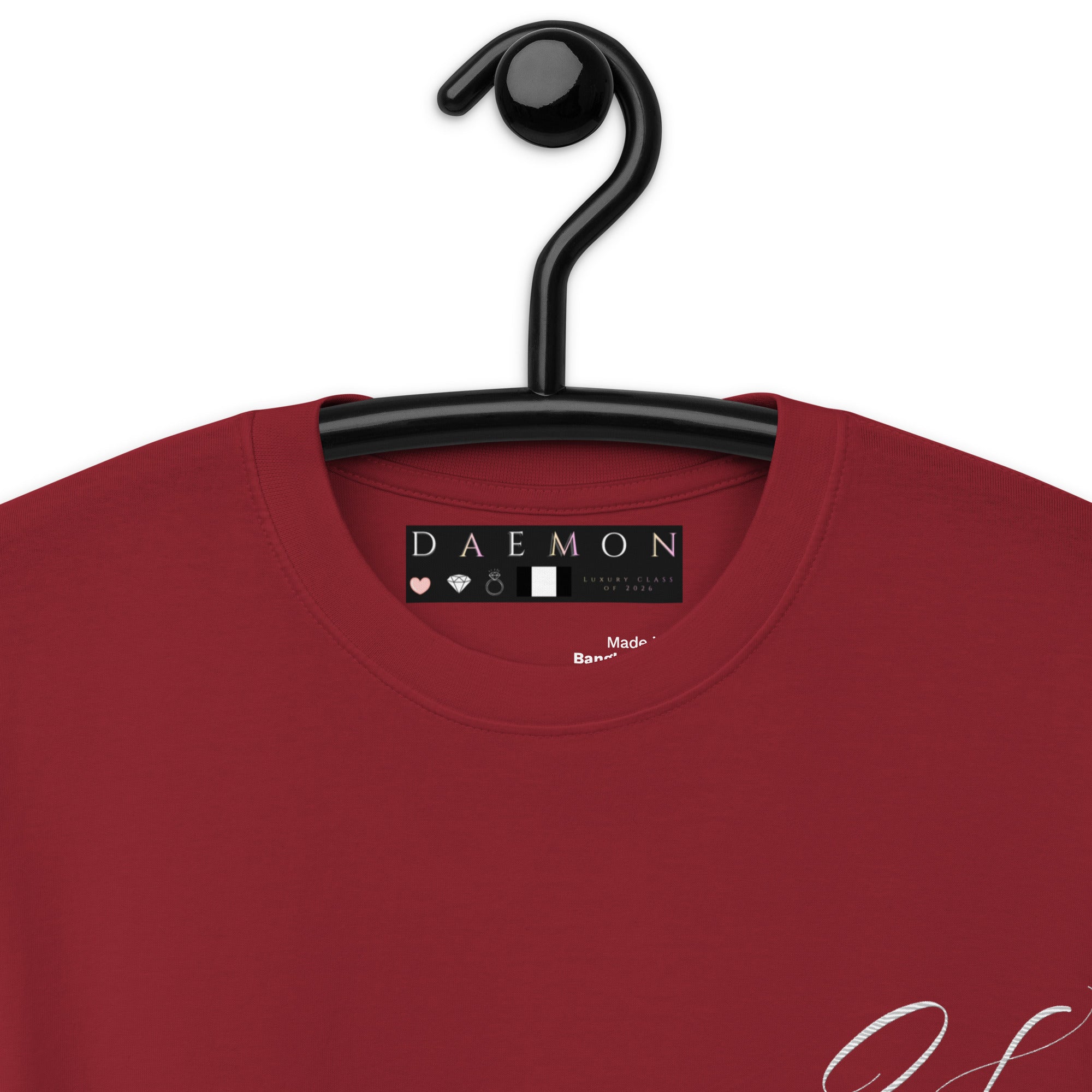 Close-up of a men's premium heavyweight T-shirt in brick red with the Distilled Blood // Heavyweight Daemon logo.