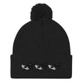 Black pom-pom-knit cap from Daemon Luxury's Night Captain single vision collection, stylish winter hat with a cozy design.