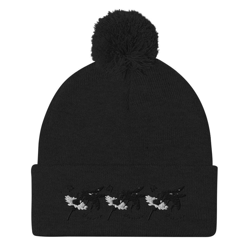 Black pom-pom-knit cap from Daemon Luxury's Night Captain single vision collection, stylish winter hat with a cozy design.