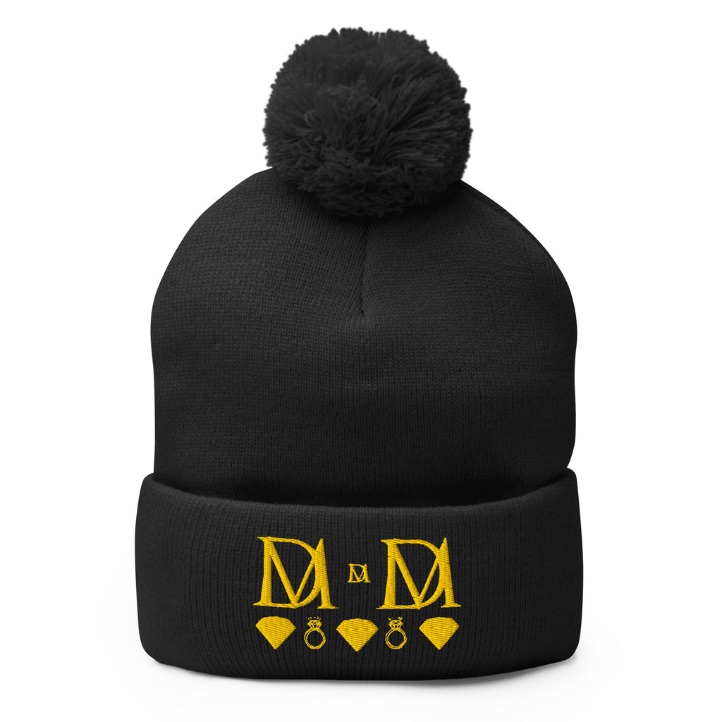 Daemon Luxury Nemesis Sun Glow wool pom-pom knit cap in black, front view showing cozy winter beanie style.