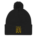 Black Nemesis Sun Glow wool knit cap with pom-pom detail by Daemon Luxury, front view of the cozy winter beanie.