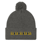 Daemon Luxury Stormless Dim Sun Glow pom-pom-knit wool cap in dark heather grey, front view showcasing cozy winter style.