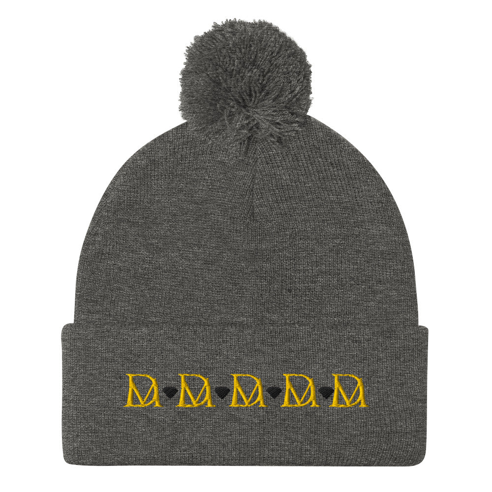 Daemon Luxury Stormless Dim Sun Glow pom-pom-knit wool cap in dark heather grey, front view showcasing cozy winter style.
