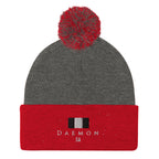 Daemon Luxury Lux Class Snow Light pom-pom-knit wool cap in dark heather grey with red accents, featuring a cozy knit design.