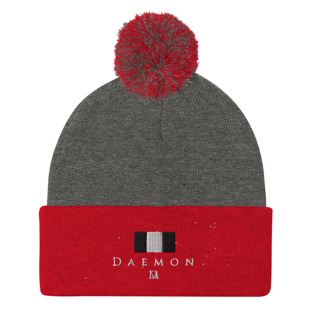 Daemon Luxury Lux Class Snow Light pom-pom-knit wool cap in dark heather grey with red accents, featuring a cozy knit design.