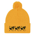 Daemon Luxury Honeybee California pom-pom knit cap in gold, showcasing a stylish front view with cozy, textured knit fabric.