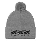 Daemon Luxury Stormless Berretto Lana knitted pom-pom hat in heather grey, front view showing cozy wool knit and playful pom-pom detail.