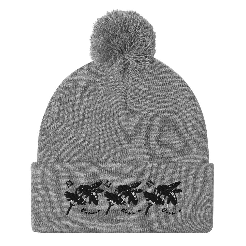 Daemon Luxury Stormless Berretto Lana knitted pom-pom hat in heather grey, front view showing cozy wool knit and playful pom-pom detail.