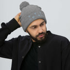 Daemon Luxury Stormless Portola berretto lana knit cap with pom-pom in heather grey, front view showing cozy wool texture.