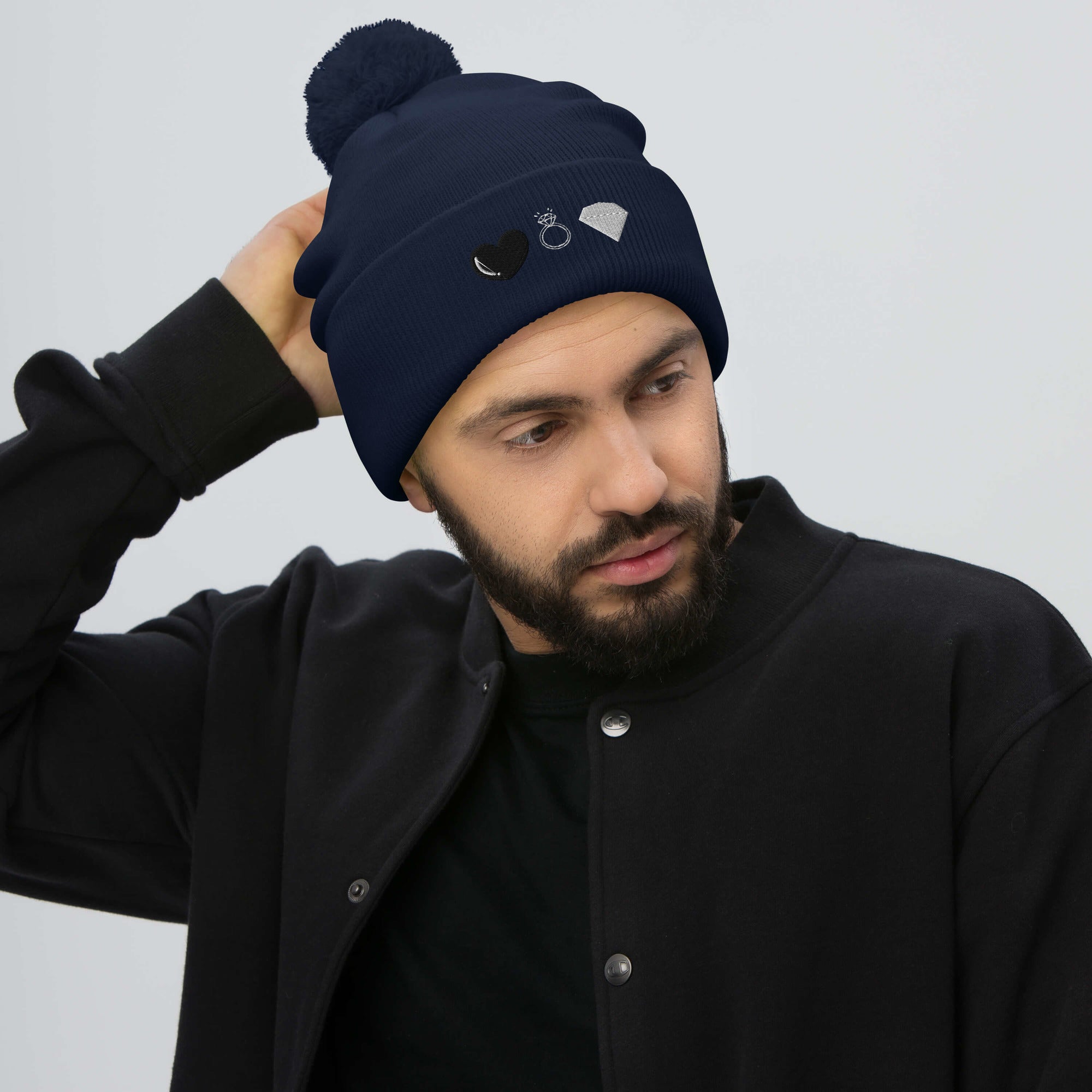 Daemon Luxury Elemental Powers Oceanic Nights navy knit pom-pom beanie cap with front design.