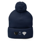 Navy pom-pom-knit cap from Daemon Luxury's Elemental Powers Oceanic Nights collection, featuring a cozy wool design.