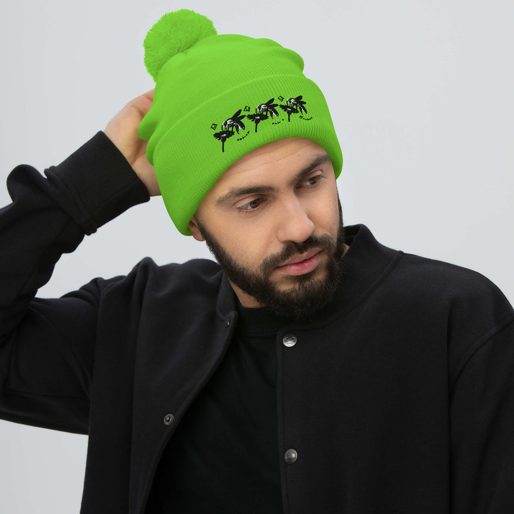 Bright neon green pom-pom knit cap from Daemon Luxury's Belly Red’s Garden Dim Sting collection, front view.