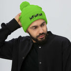Bright neon green pom-pom knit cap from Daemon Luxury's Belly Red’s Garden Dim Sting collection, front view.