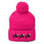 Neon pink pom-pom knit cap by Daemon Luxury featuring stitched candies pattern on front, cozy lana design.