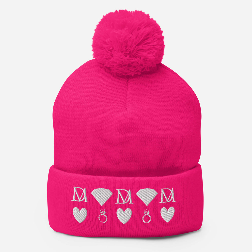 Pink knitted pom-pom cap with neon pink stitches and stitched candies design, from Daemon Luxury's Berretto Lana collection.
