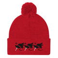 Red pom-pom knit cap from Daemon Luxury's Flash of Red (Dim Sting) collection, featuring a cozy wool design and front view.