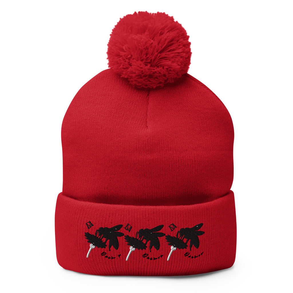 Red pom-pom knit cap from Daemon Luxury's Flash of Red (Dim Sting) collection, featuring a cozy wool hat with a front view.