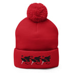 Red pom-pom knit cap from Daemon Luxury's Flash of Red (Dim Sting) collection, featuring a cozy wool hat with a front view.