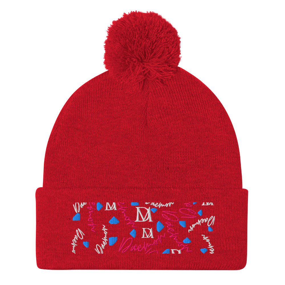 Red pom-pom knit cap from Daemon Luxury's Flash of Red Picasso Mirrors collection, featuring a cozy lana material and front view.