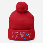 Red pom-pom knit cap from Daemon Luxury's Flash of Red Picasso Mirrors collection, featuring a cozy wool berretto with front detail.