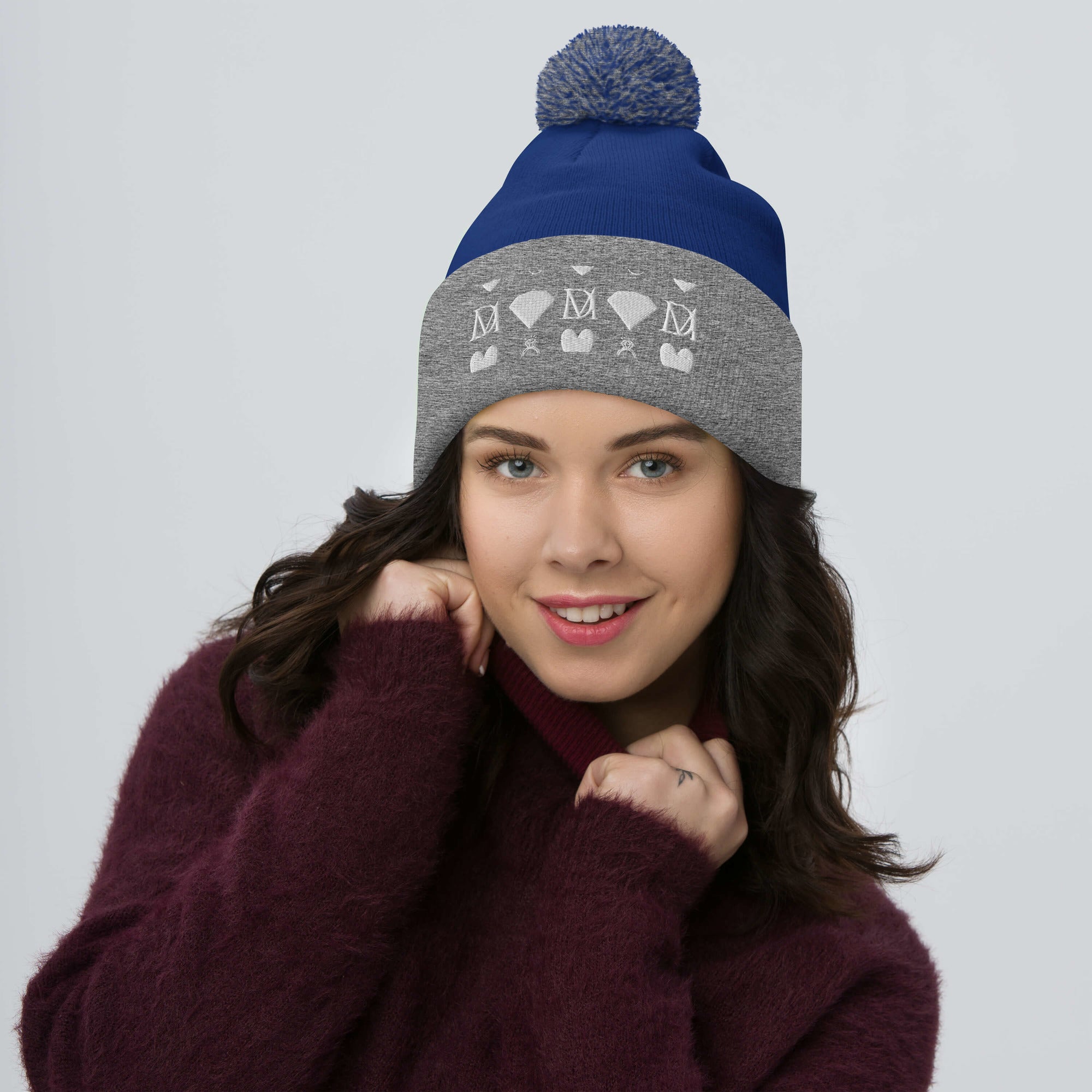 Daemon Luxury Storm Gen Frosted Diamonds wool pom-pom knit cap in royal heather grey, front view.