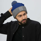 Daemon Luxury Storm Gen Frosted Diamonds wool pom-pom knit cap in royal heather grey, front view showing cozy winter style.
