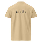 Unisex Daemon Luxury Picasso Mirrors stitched label premium pique polo shirt in sand, showing back view with collar and label details.
